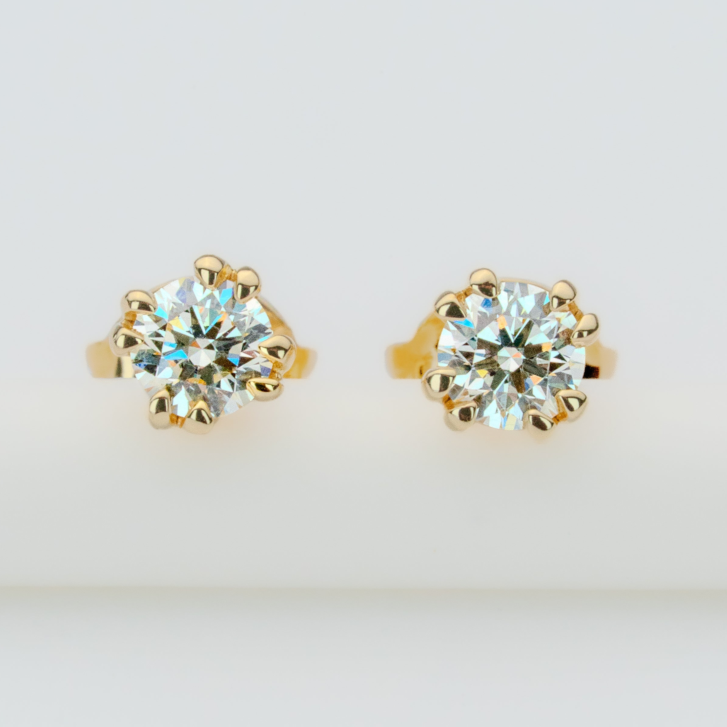Gold Earth earrings peak Stud earrings with removable chain jacket. 4 natural Canadian diamonds set in Modern Electrum™ from Ekati.