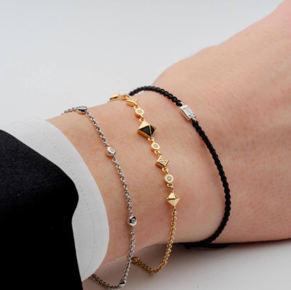Unisex LANDS layered natural diamond bracelets in gold and silver modern electrum. Spirit ascent, earth ascent ii and ice origin.