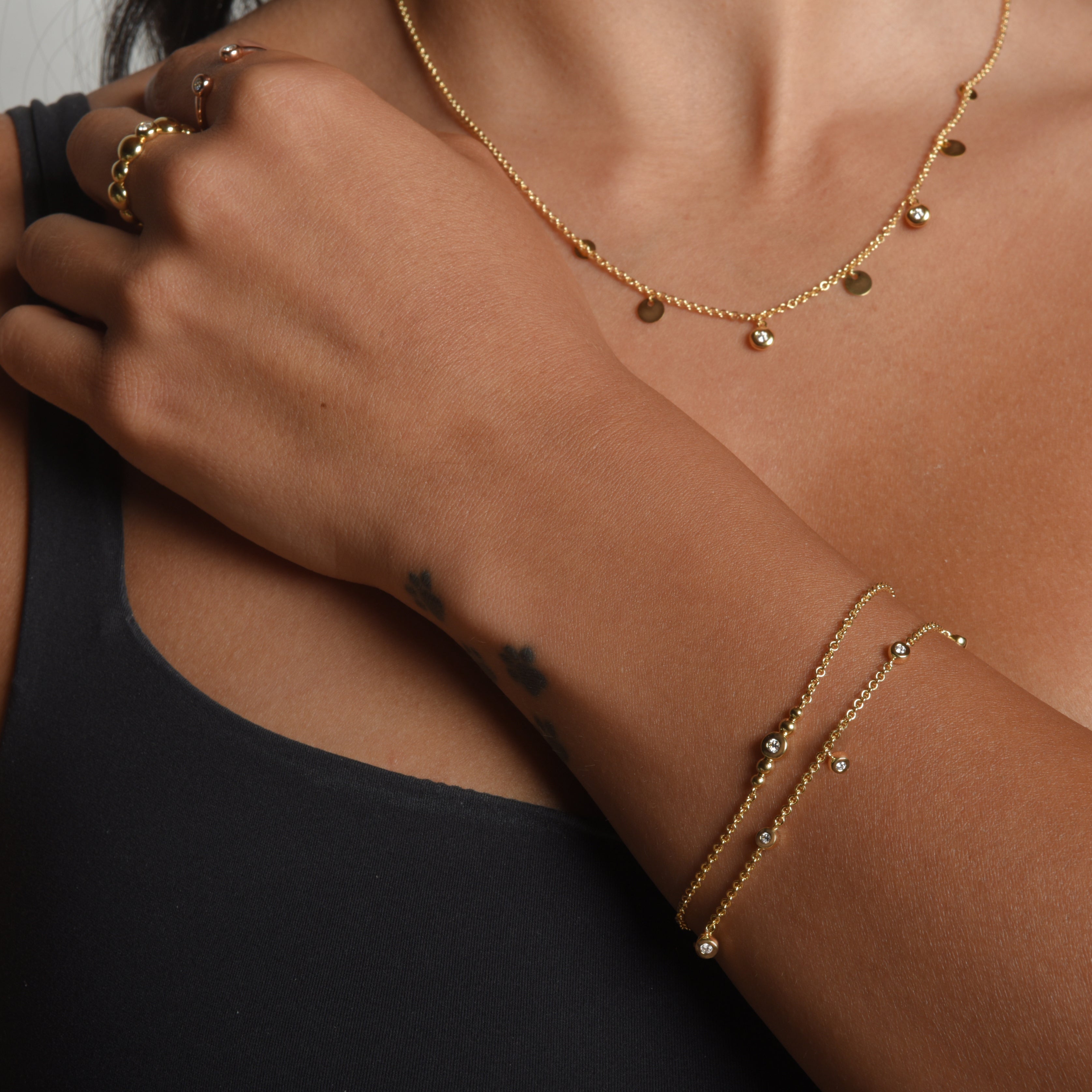 Unisex Fluorescent diamond bracelet. LANDS spirit origin in gold modern electrum on 1.8mm chain. Diamonds that glow.