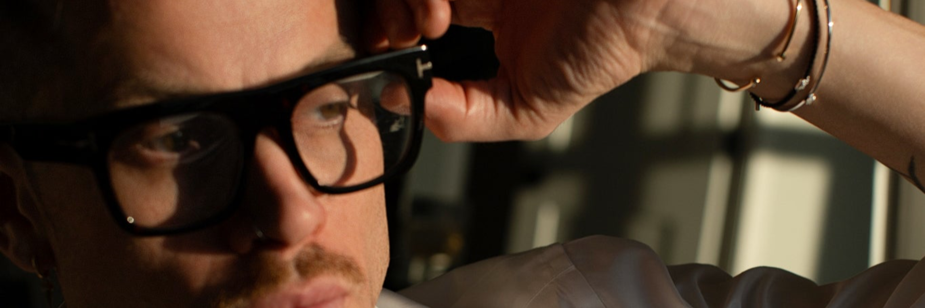 Unisex stacked natural bracelets and layered necklaces displayed on male model