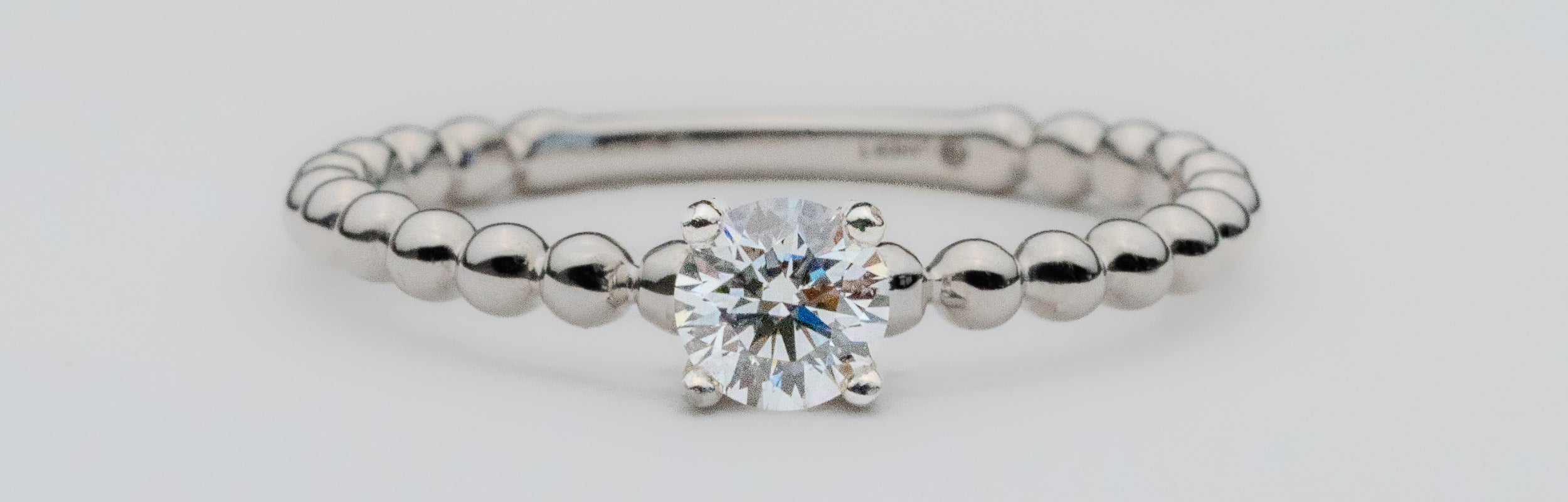 Spirit Ring Peak with solitaire Gahcho Kué diamonds that glow set in Modern Electrum