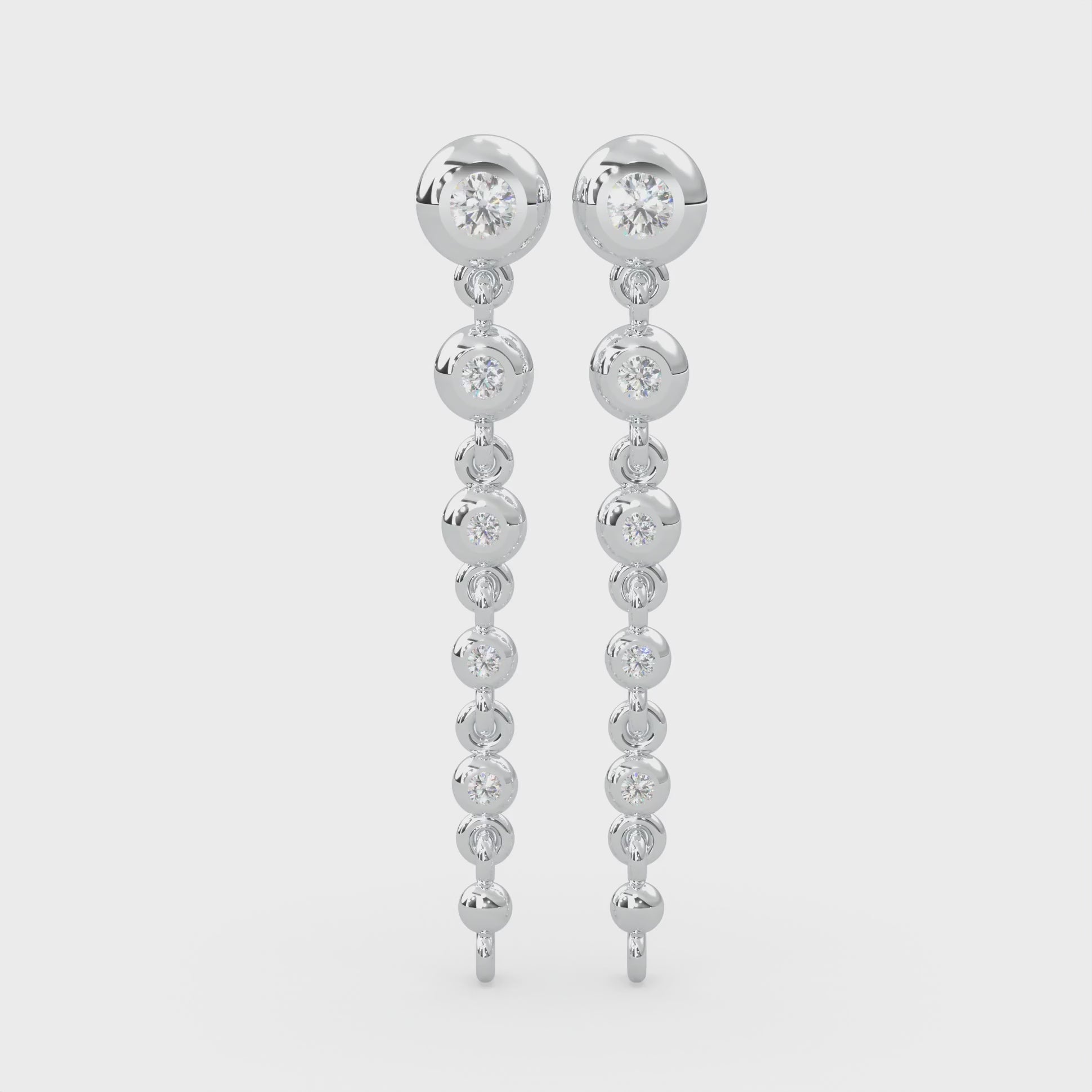 Ten round-cut type 2a glowing natural Canadian diamonds. 0.20 carat total weight. Dangle chain design set in Modern Electrum™. D to H in color and SI clarity and above. Gahcho Kué spirit collection 500 million years old.