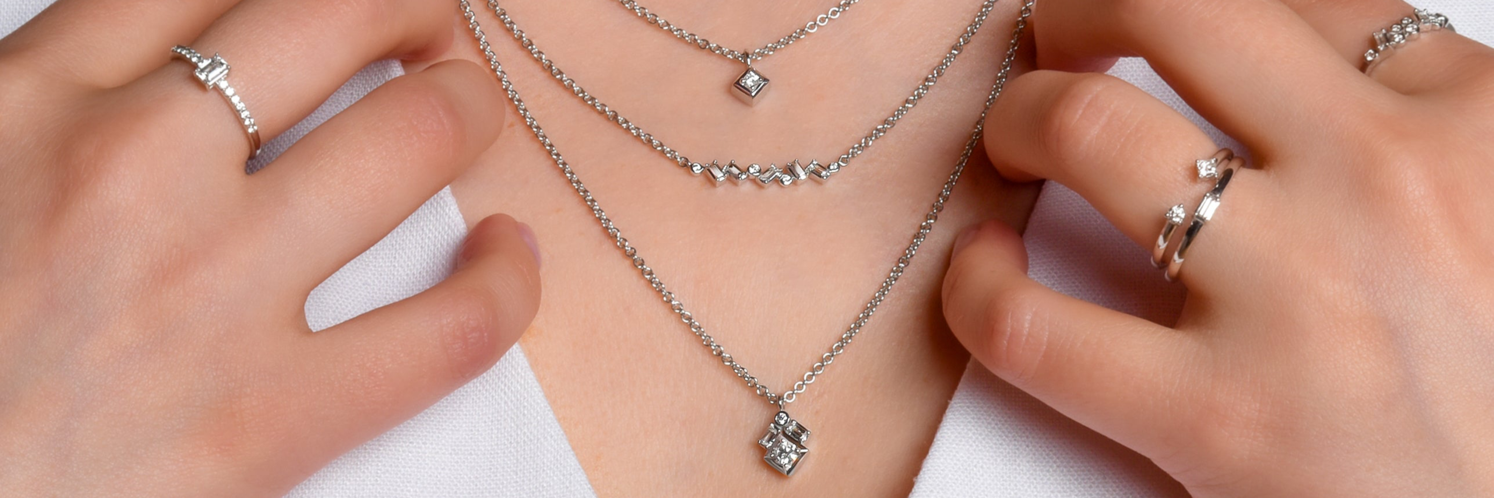 Unisex Layered Ice Collection Diamond Necklaces in silver modern electrum. Ultra rare diavik diamond rings.