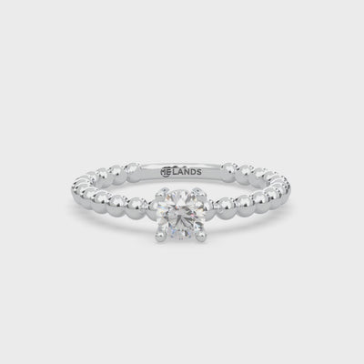 1 round-cut type 2a glowing natural Canadian Gahcho Kué diamond. 0.29 carat total weight. Solitaire design set in Modern Electrum™. D to H in color and SI clarity and above. spirit collection 500 million years old. Diamonds that glow in the dark.