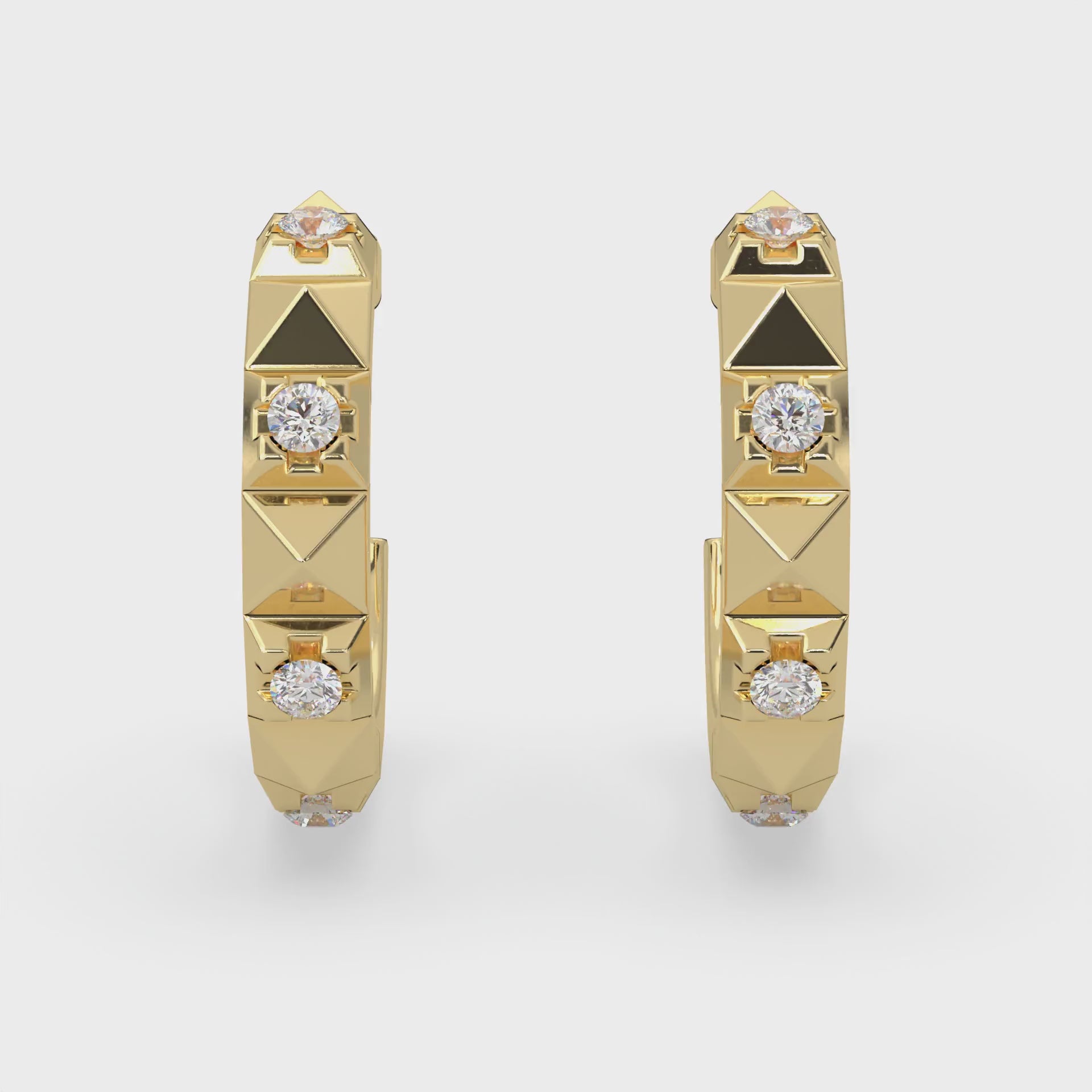 Hoop earrings. Eight round natural Canadian diamonds. 0.13 carat total weight set in Modern Electrum™. Color range from K to Z, with a clarity of SI and above. Ekati mine. 45 to 55 million years old. 