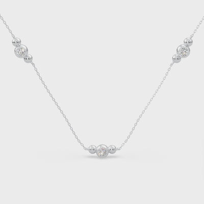 White Modern Electrum Jewelry. Three-stone fluorescent diamond necklace. Round diamonds that glow on an adjustable 1.8mm chain.